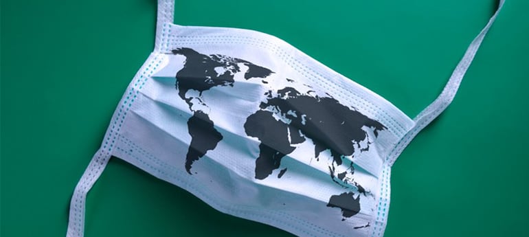 a surgical mask with a silhouette of a world map on it